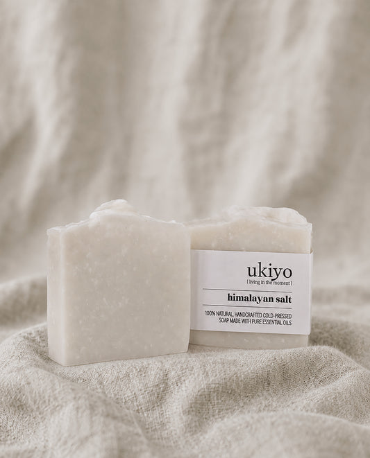 Bar of himalayan salt soap with 'ukiyo' label on a textured beige background