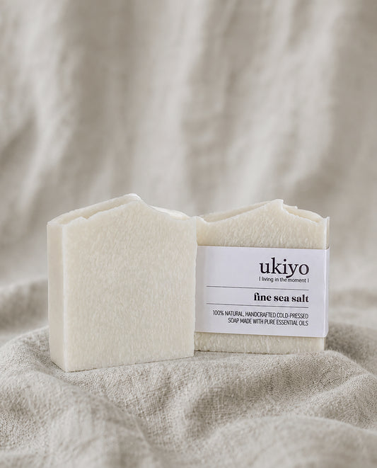 Bar of sea salt soap with a 'ukiyo' label on a textured beige background
